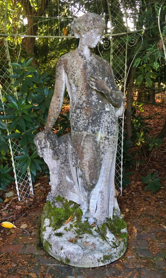 A life size reconstituted stone figure of a classical woman, repairs